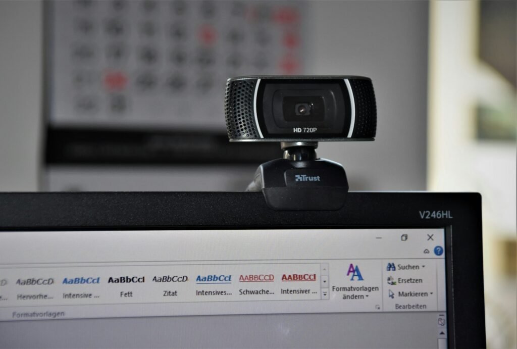 Webcam mounted on a monitor in a home office for video meetings on Zoom, Teams and Google Meet